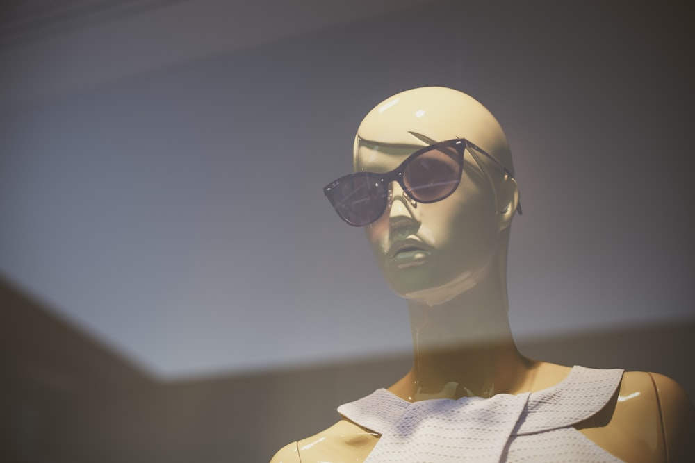 black cat-eye sunglasses on mannequin