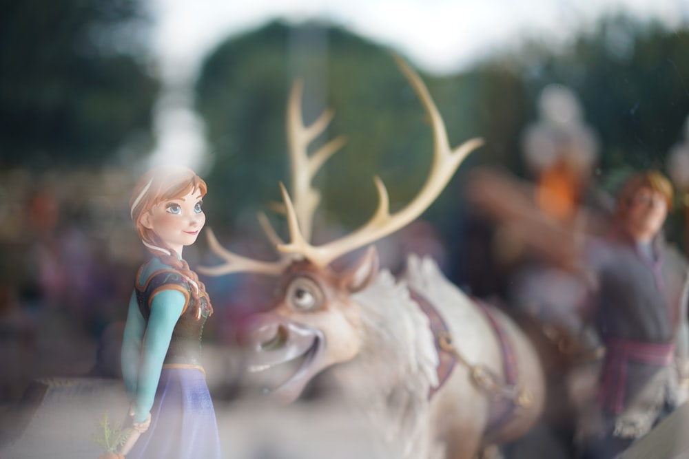 Disney Frozen characters behind glass panel