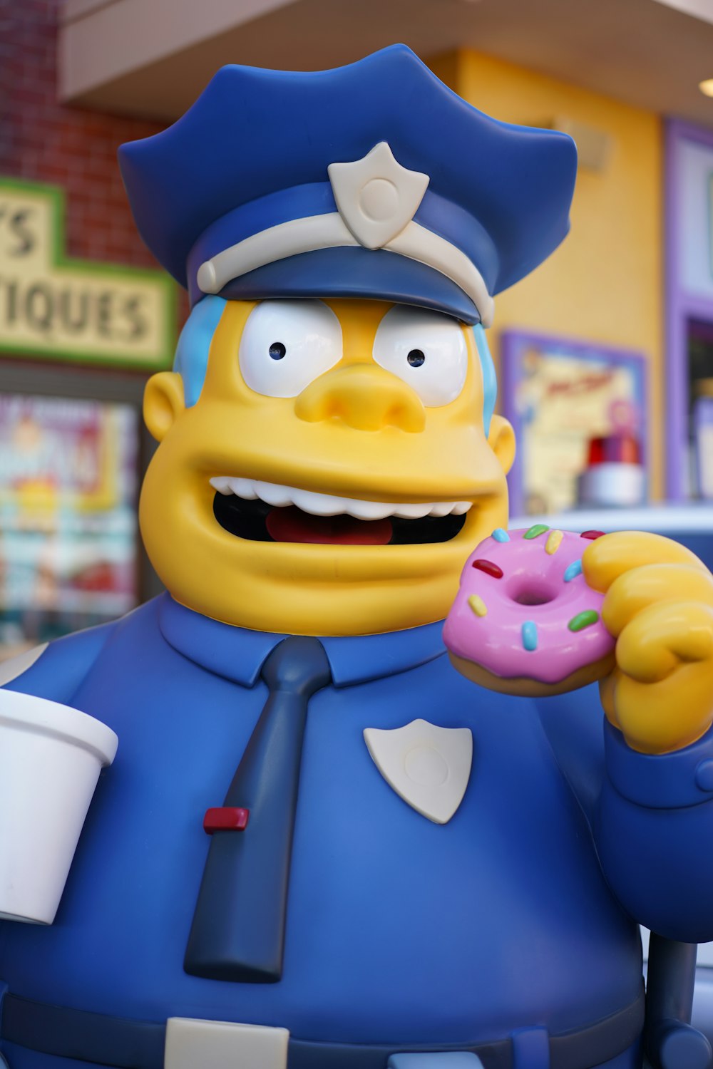 police man eating doughnut