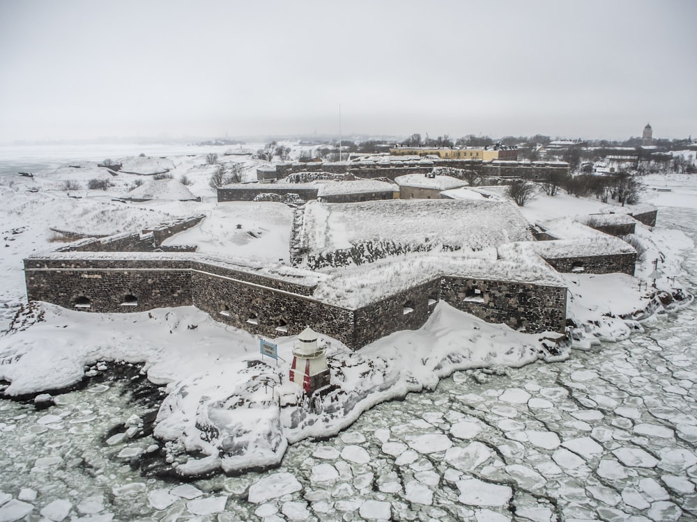 houses and field covered with snow