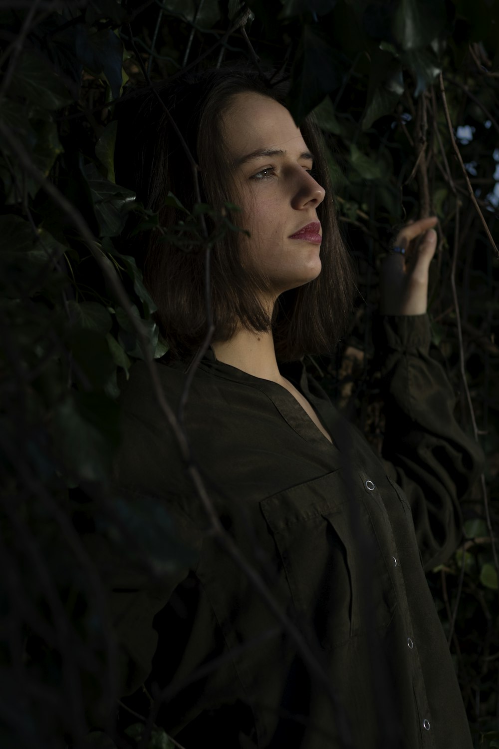 woman wearing black button-up long-sleeved shirt