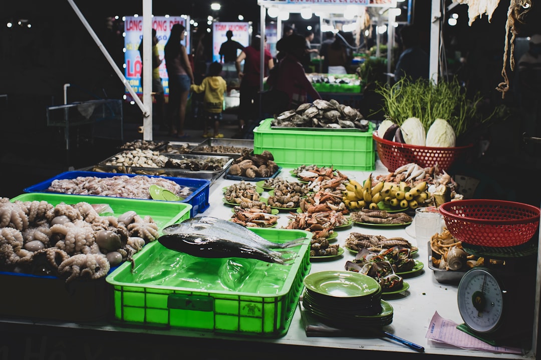 different fish, fruits, and vegetable on display in the market