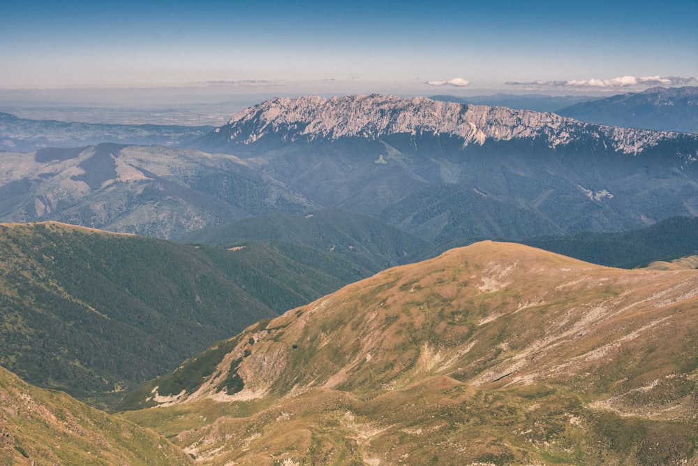 green and brown mountains under blue sky during daytime