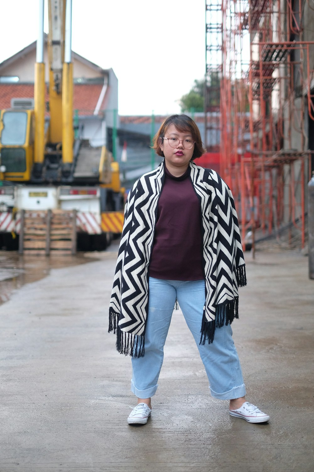 woman standing near construction building