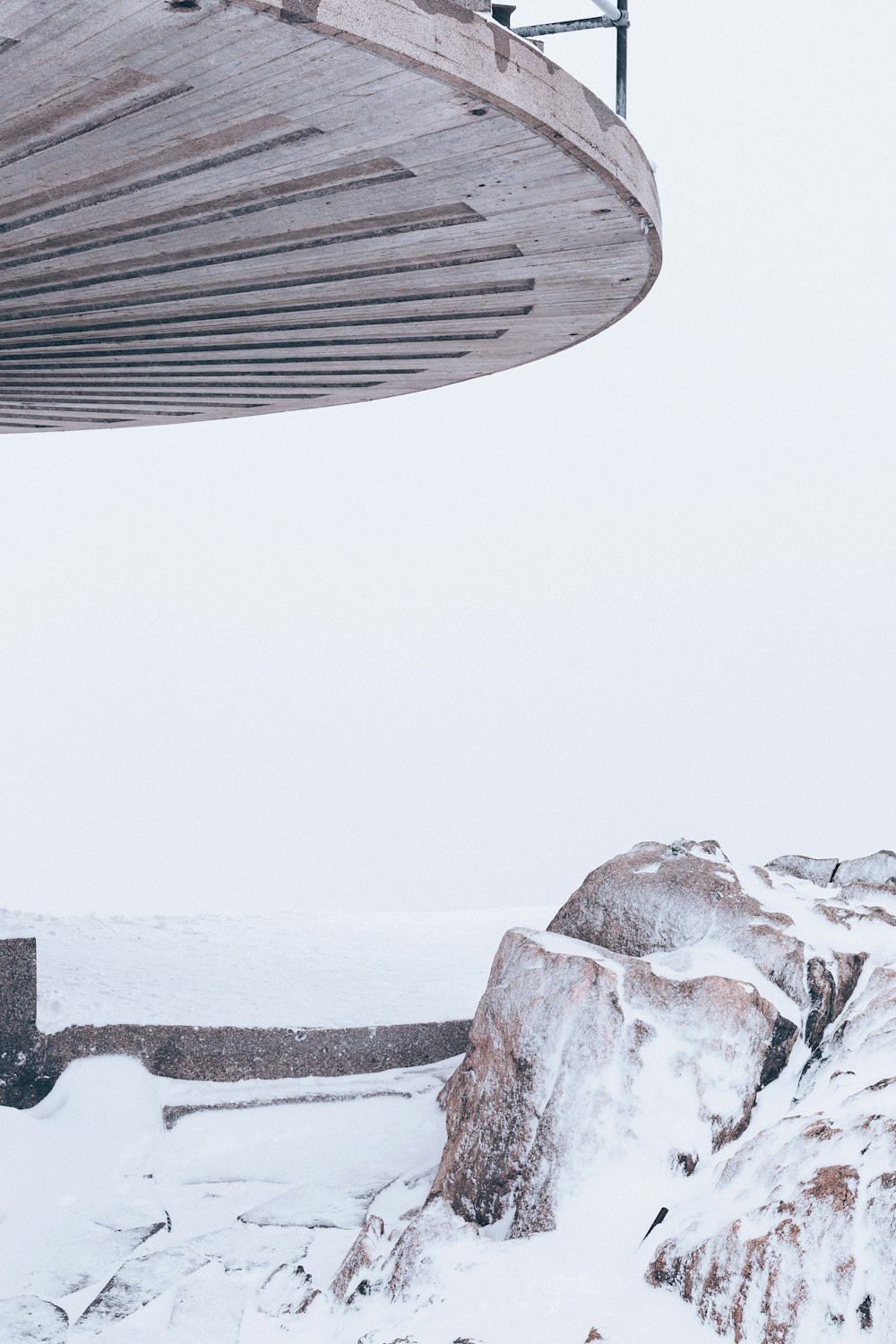 rocks covered with snow during daytime