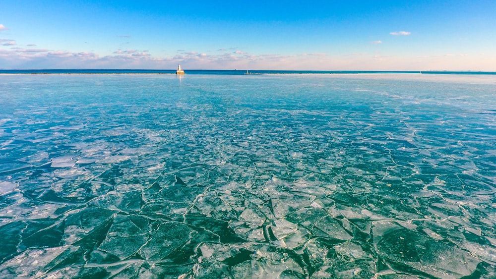 a body of water with a boat in the distance