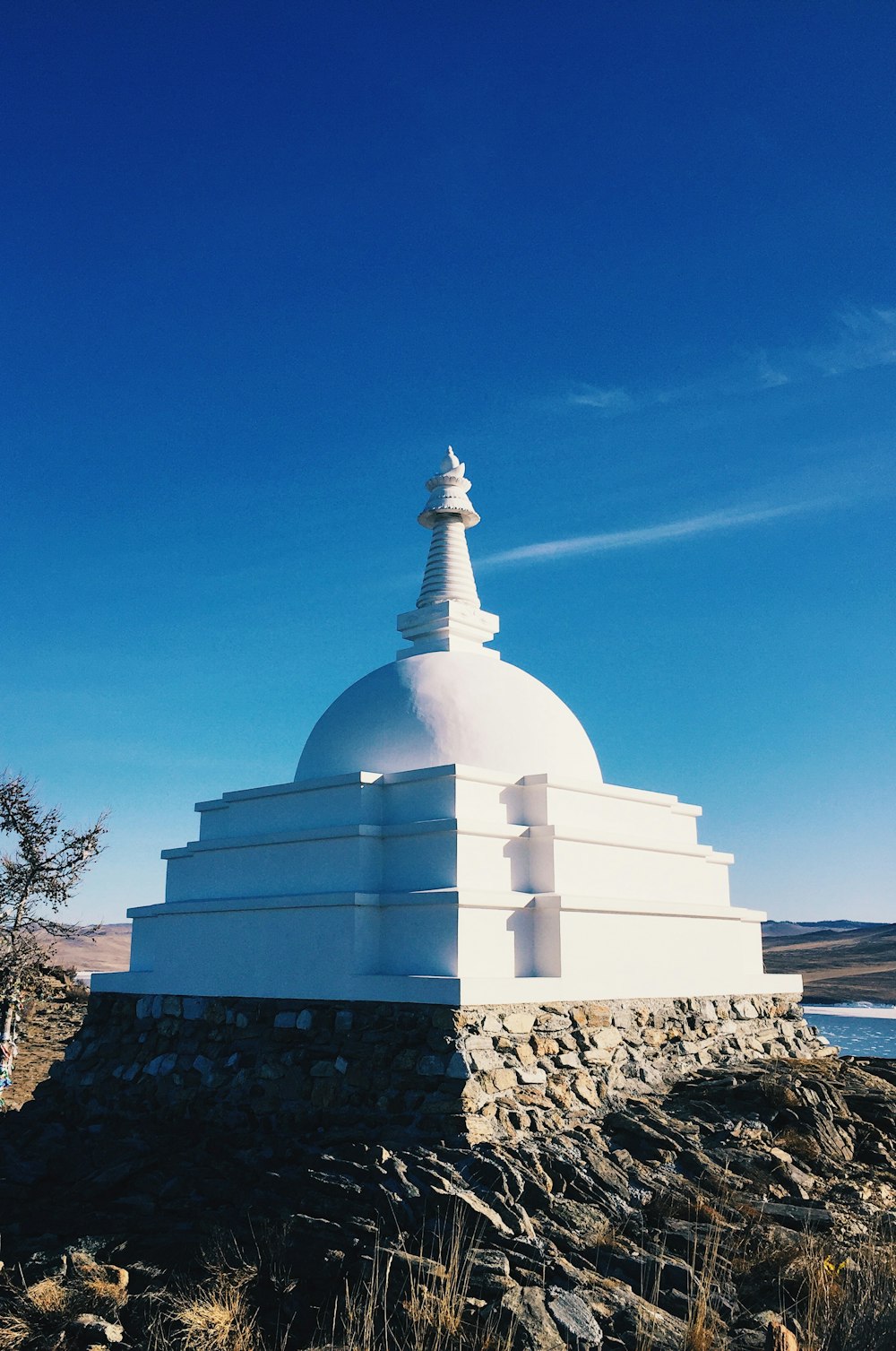 white concrete dome under blue sky