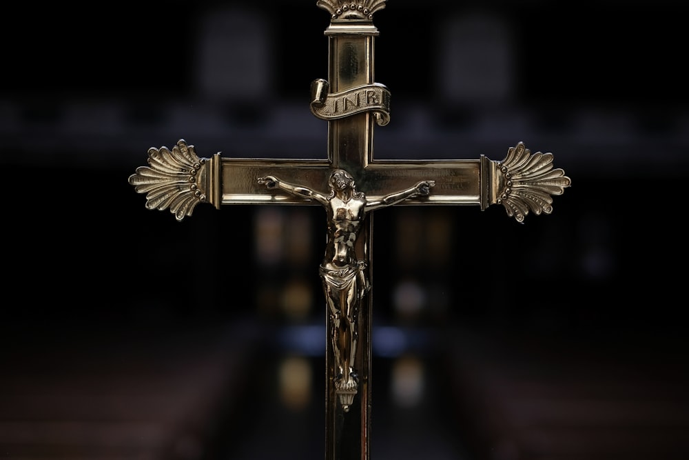 selective focus photography of crucifix