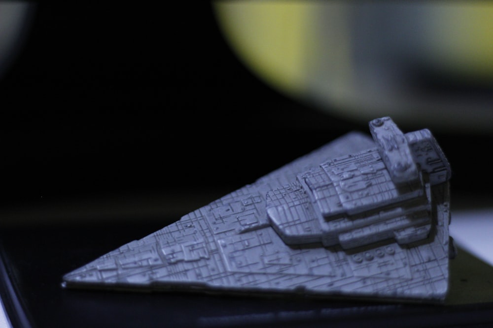 selective focus photography of gray spaceship toy