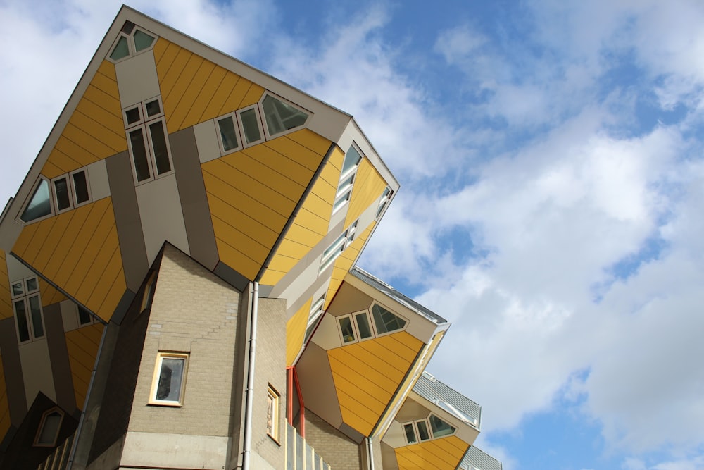 low angel photography of grey and yellow concrete building