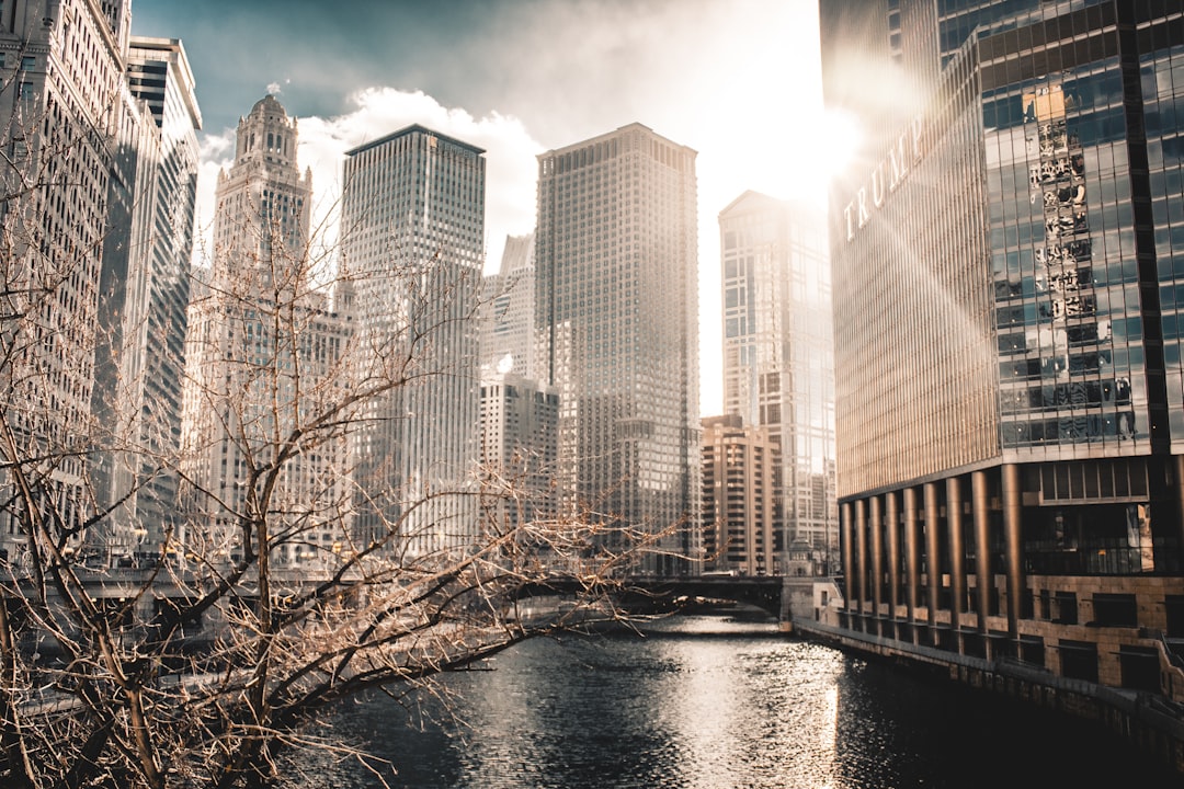 a river running through a city with tall buildings,