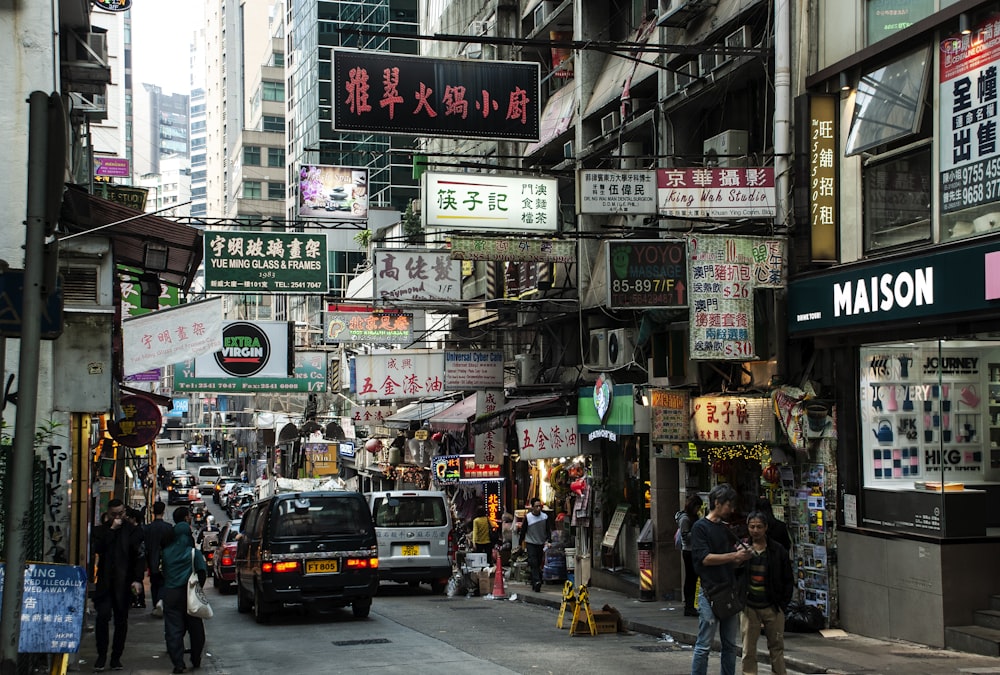 a busy city street filled with lots of signs