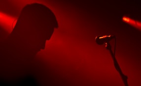 a person standing in front of a microphone