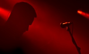 a person standing in front of a microphone