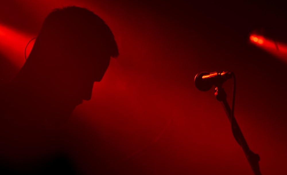 a person standing in front of a microphone