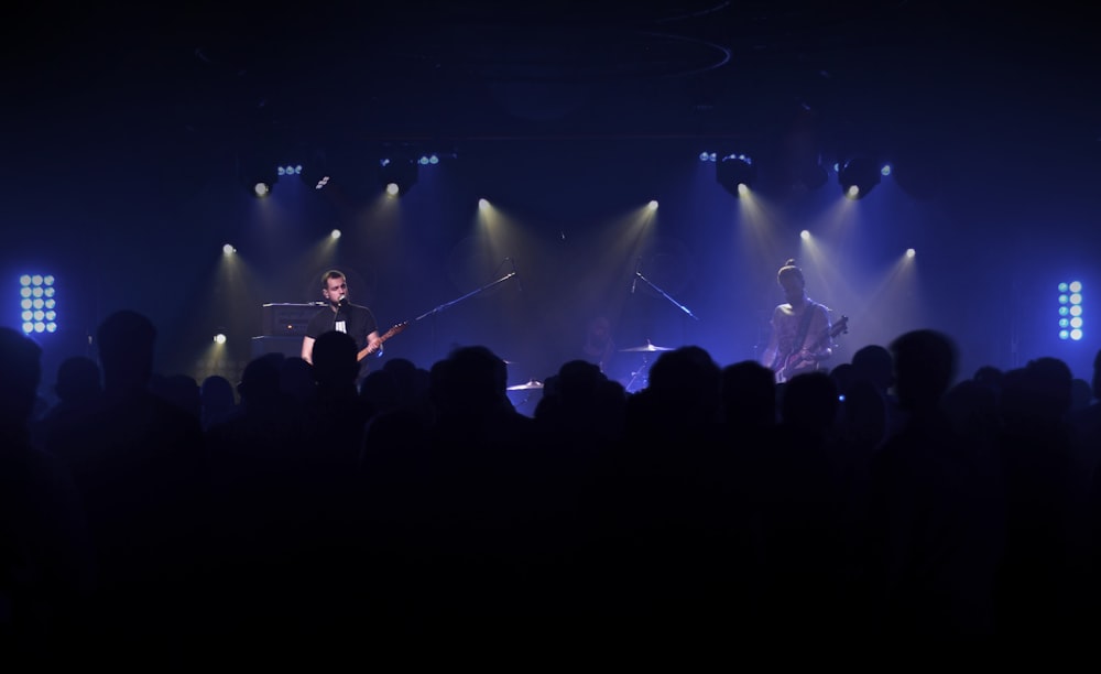 a group of people standing on top of a stage