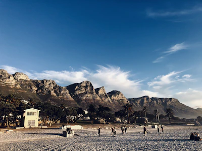 people walking on sand during daytime