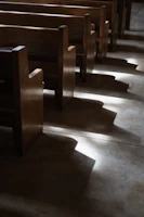 Pastor delivering an inspiring sermon with soft natural light highlighting the pulpit.