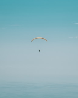 person paragliding photography