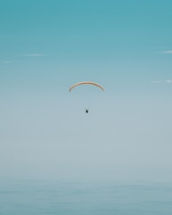 person paragliding photography