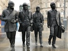 4-men group band statues
