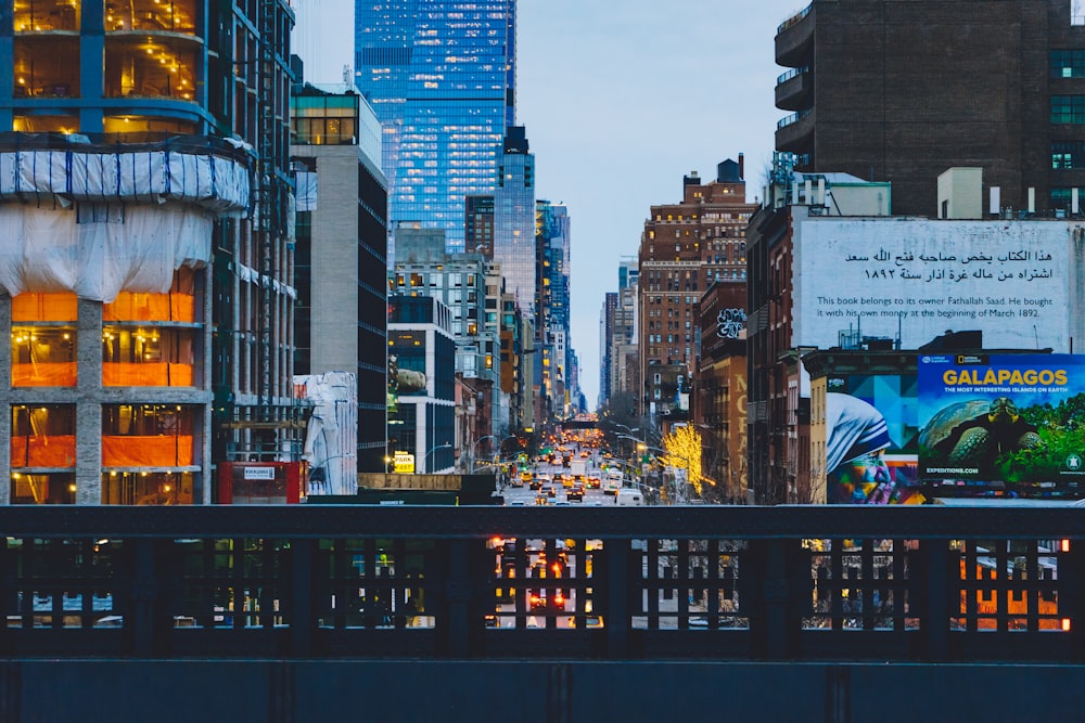 a city street filled with lots of tall buildings