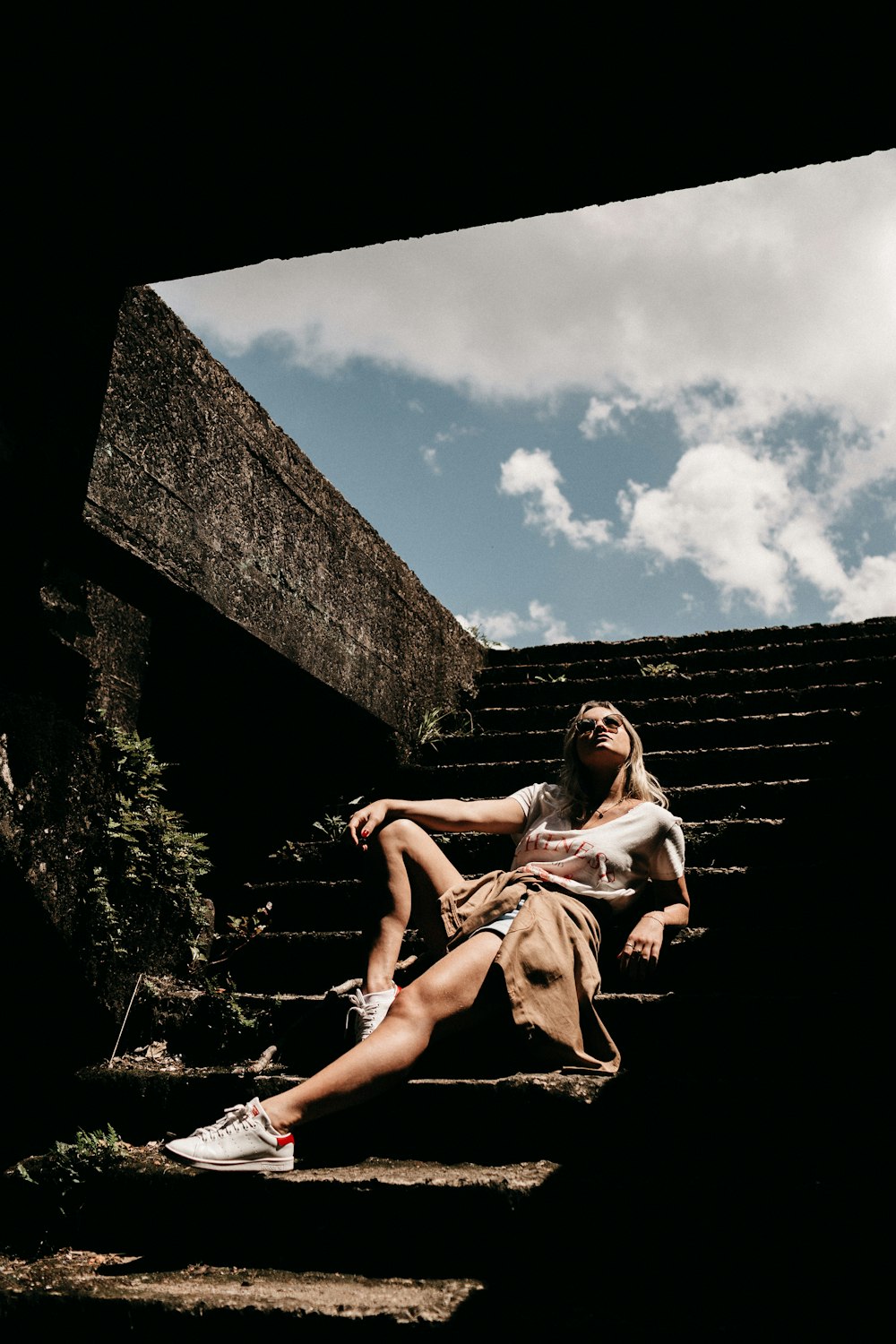 woman sitting on stairs