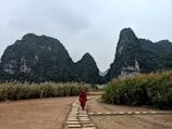man walking on pathway