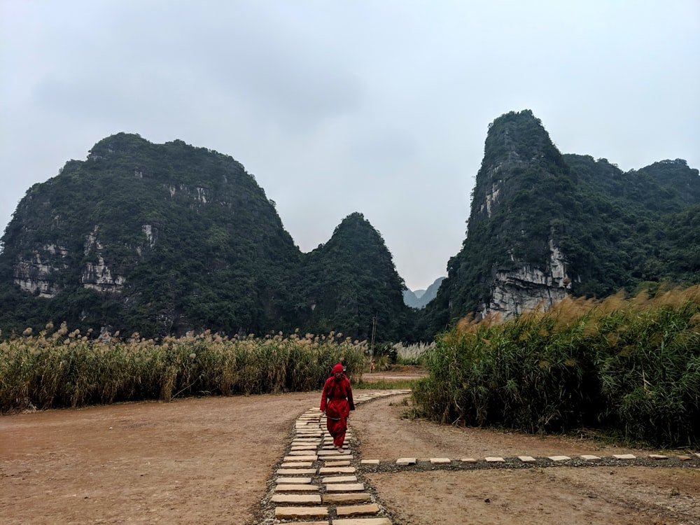 man walking on pathway