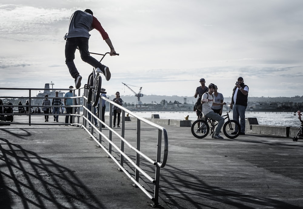 man doing tricks while riding on bike