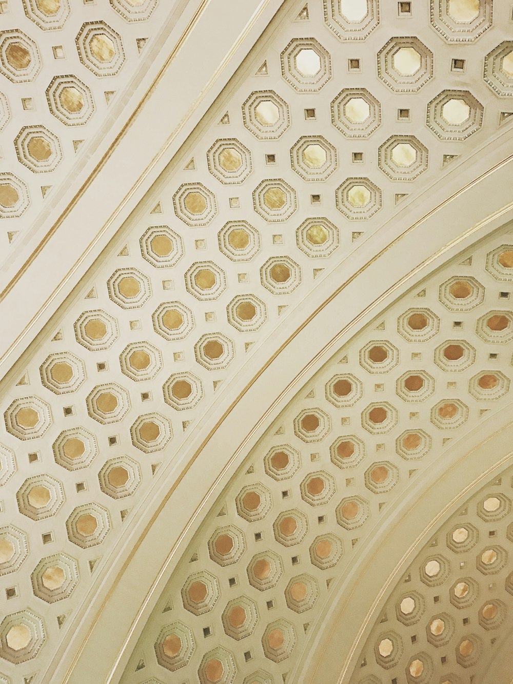 white and gold-colored ceiling