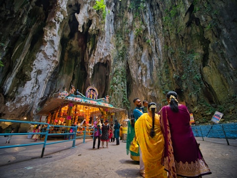 two women wearing salwar kameez near mountain cliff