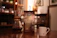 A cozy kitchen scene with a steaming cup of coffee next to a Brewmosaic coffee pack.