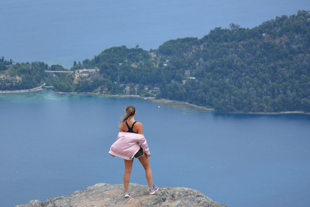 woman standing on cliff