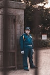 man standing concrete gate