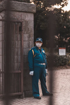 man standing concrete gate