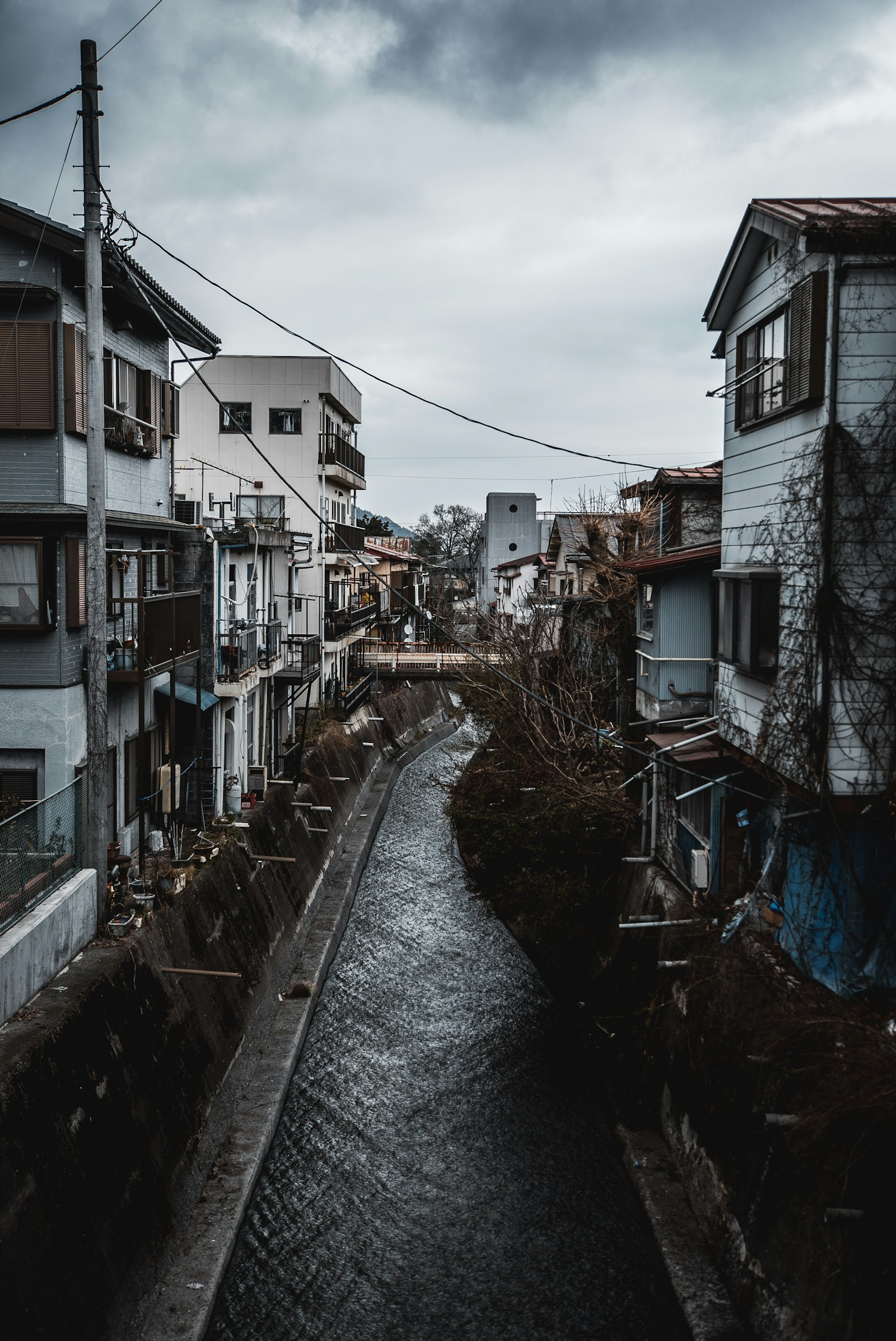 Tamron 18-270mm F3.5-6.3 Di II PZD sample photo. Canal inline of houses photography