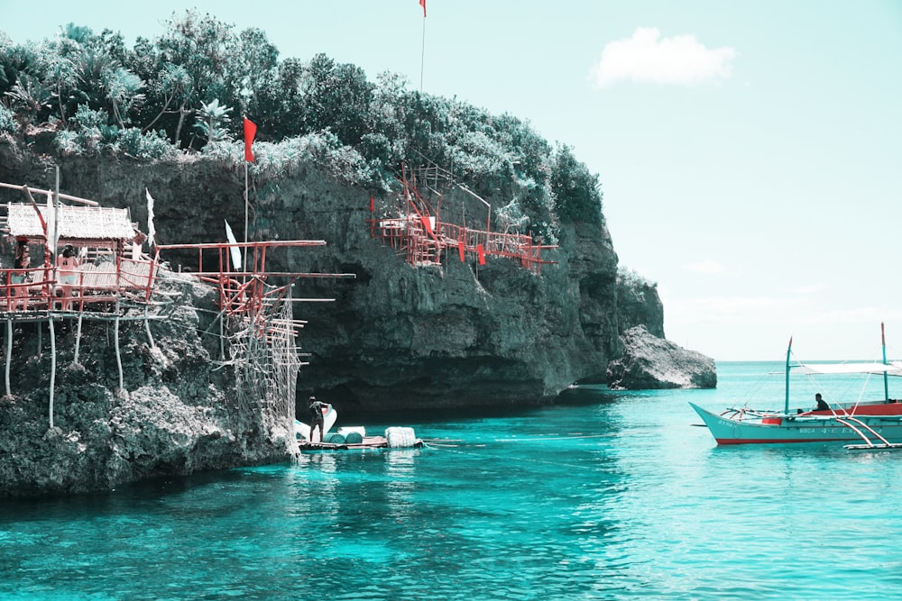 man riding a boat near island