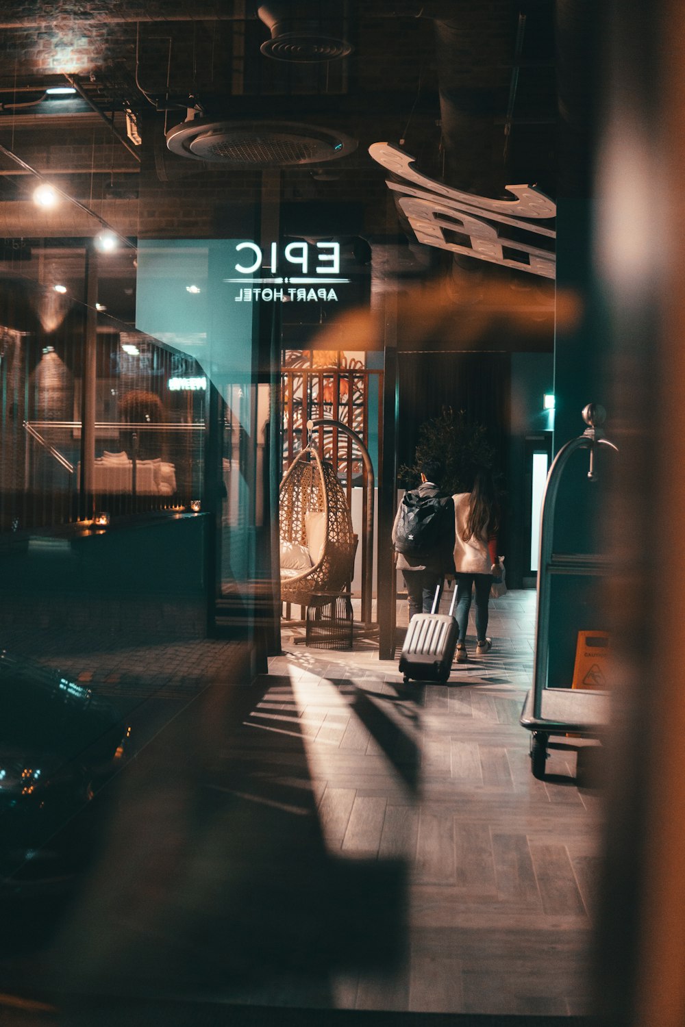 two people walking through doorway