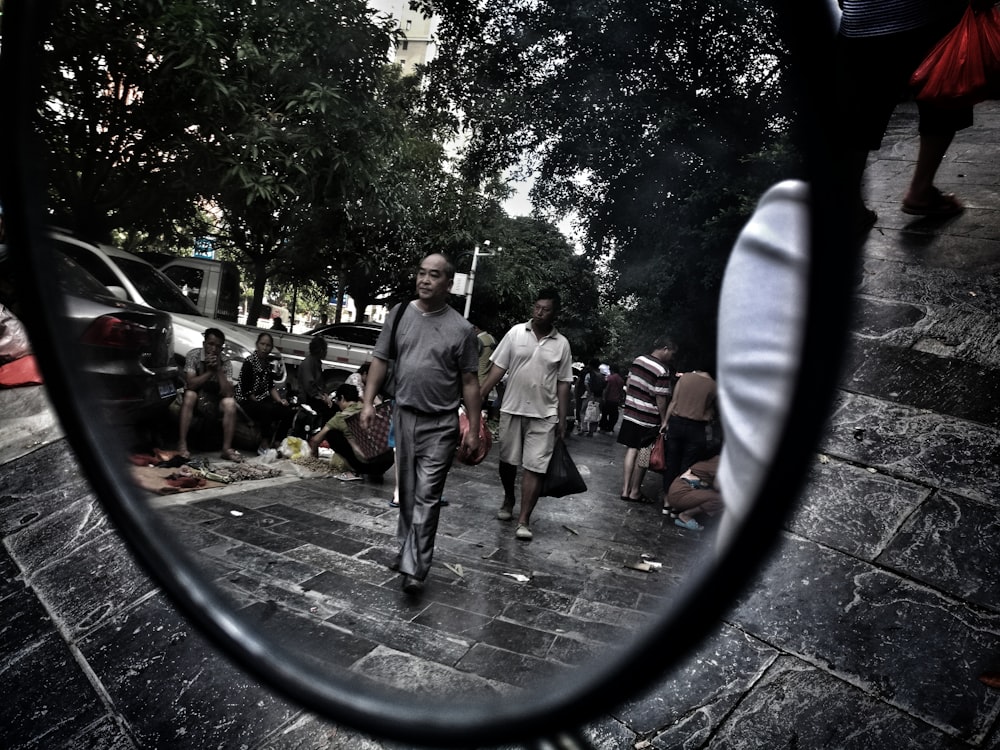 reflection of man and woman walking