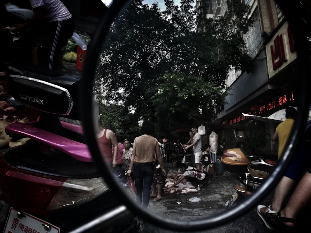taking photo using motorcycle side mirror