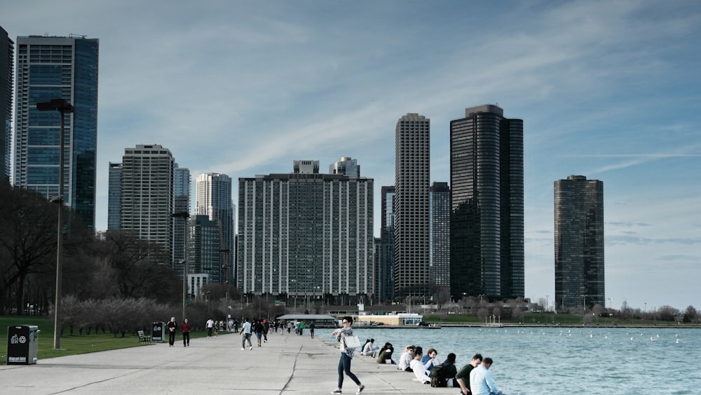 people sitting beside beach during daytime