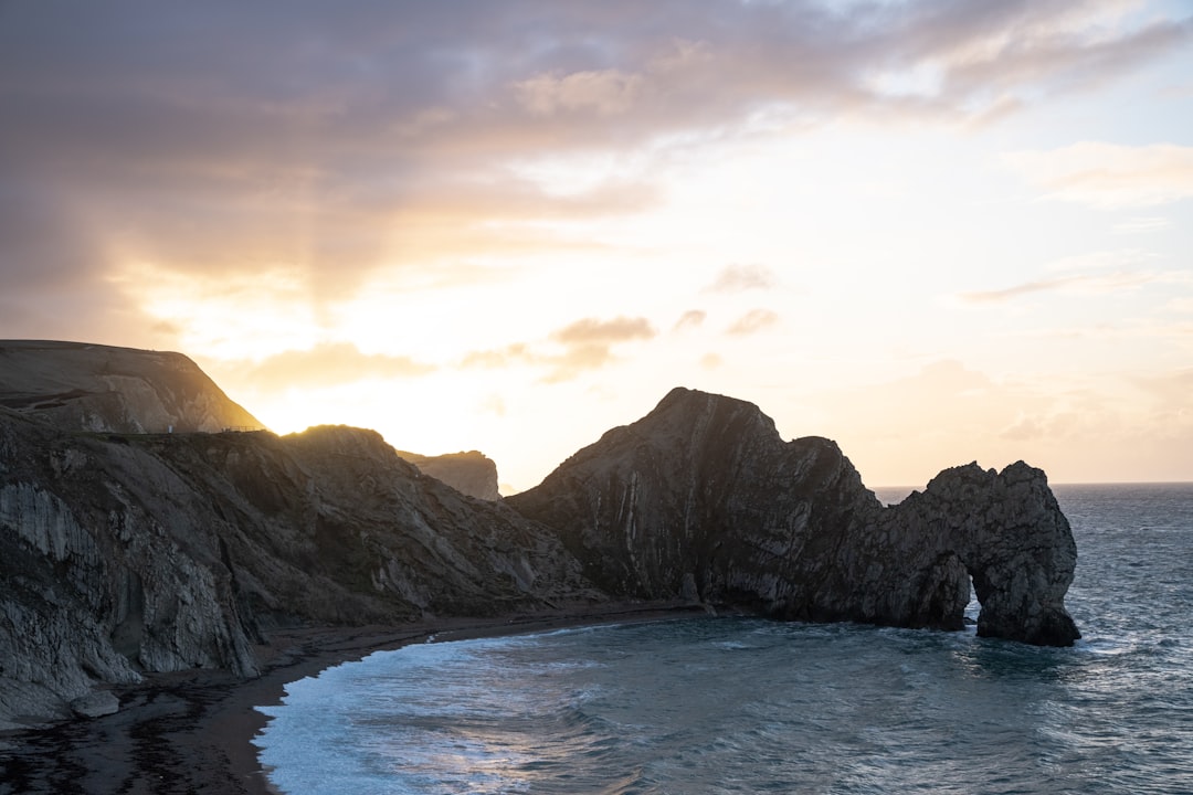 landscape photo of mountain near body of water during daytime