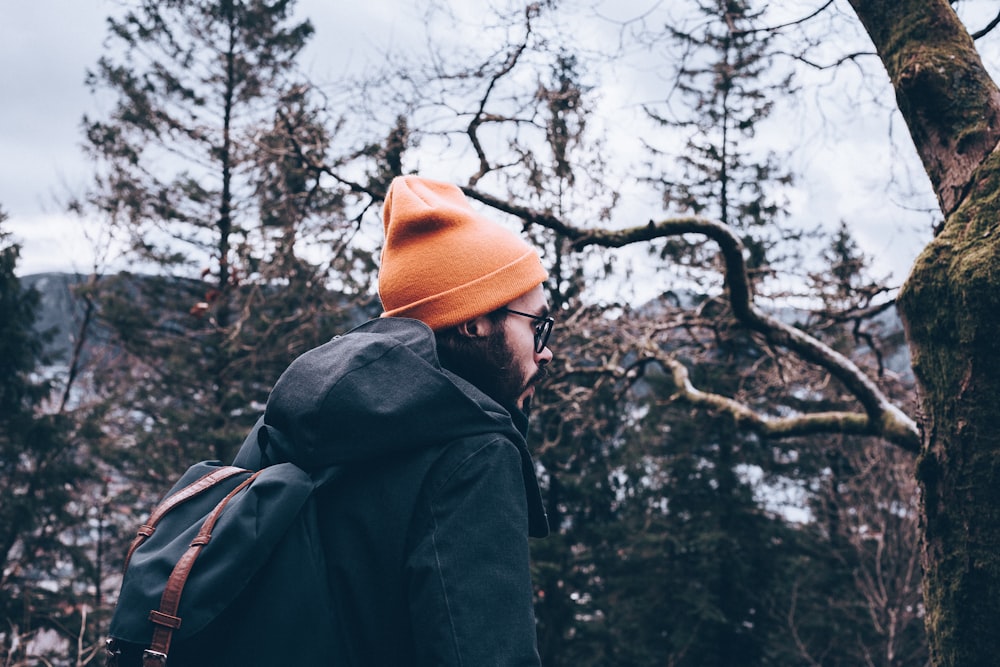 person wearing orange knit cap