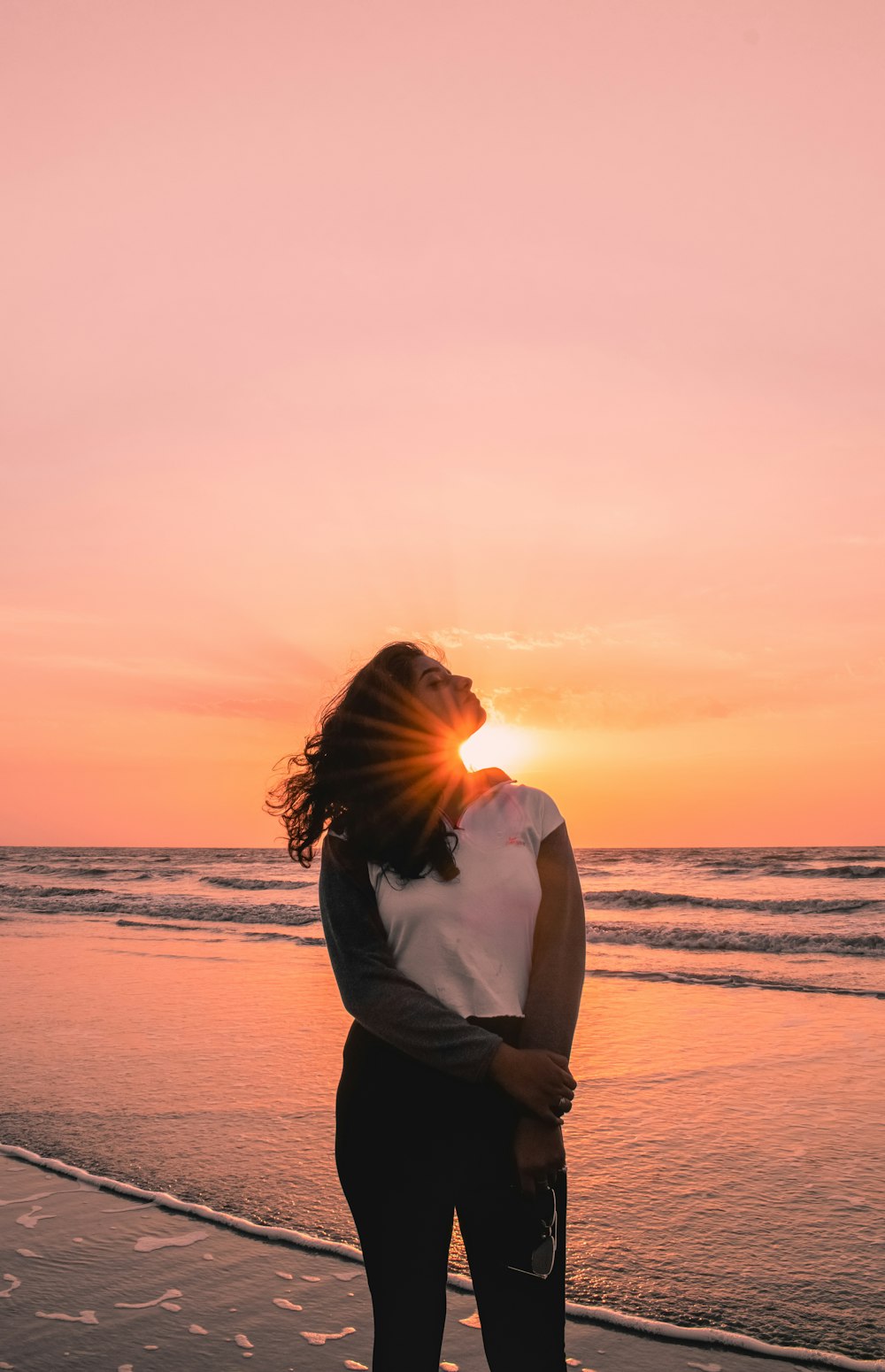 woman standing on seashore