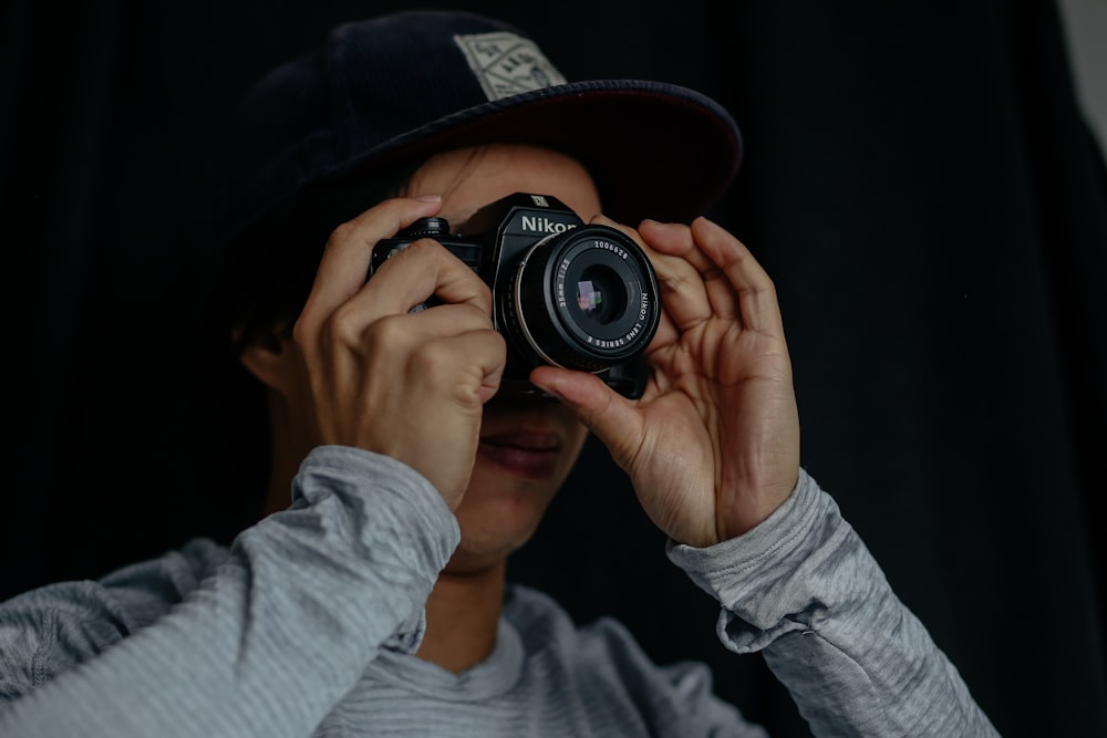 man taking photo using camera