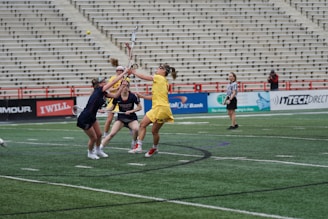 A dynamic image of a women's lacrosse game in action.