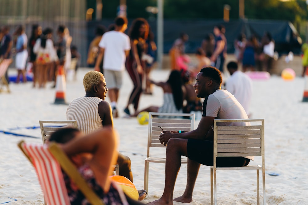 selective focus of man and woman sitting next to each other