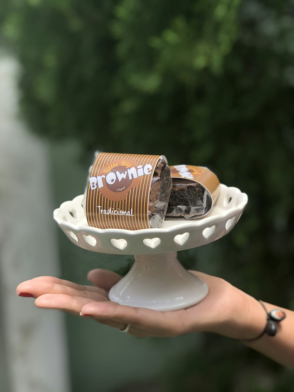 two brown cans and white cake stand