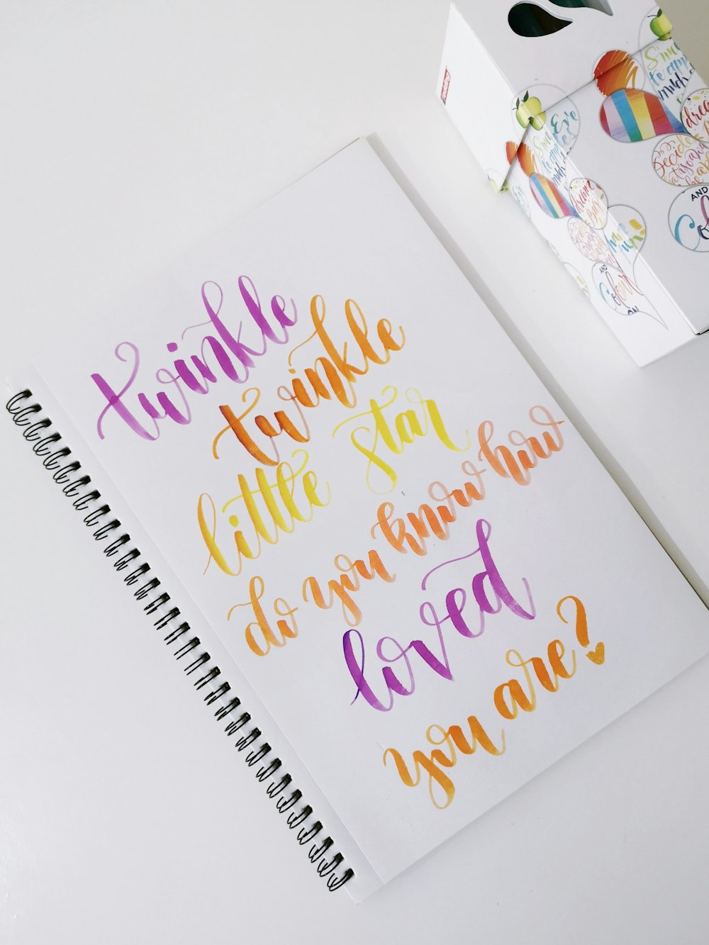 a notebook with a handwritten quote on it